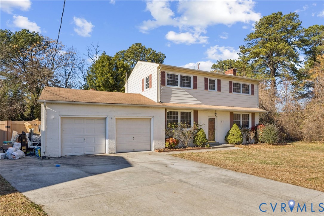 4 Michele Drive Hampton, VA 23669 - Photo 2 of 36 a front view of a house with a yard