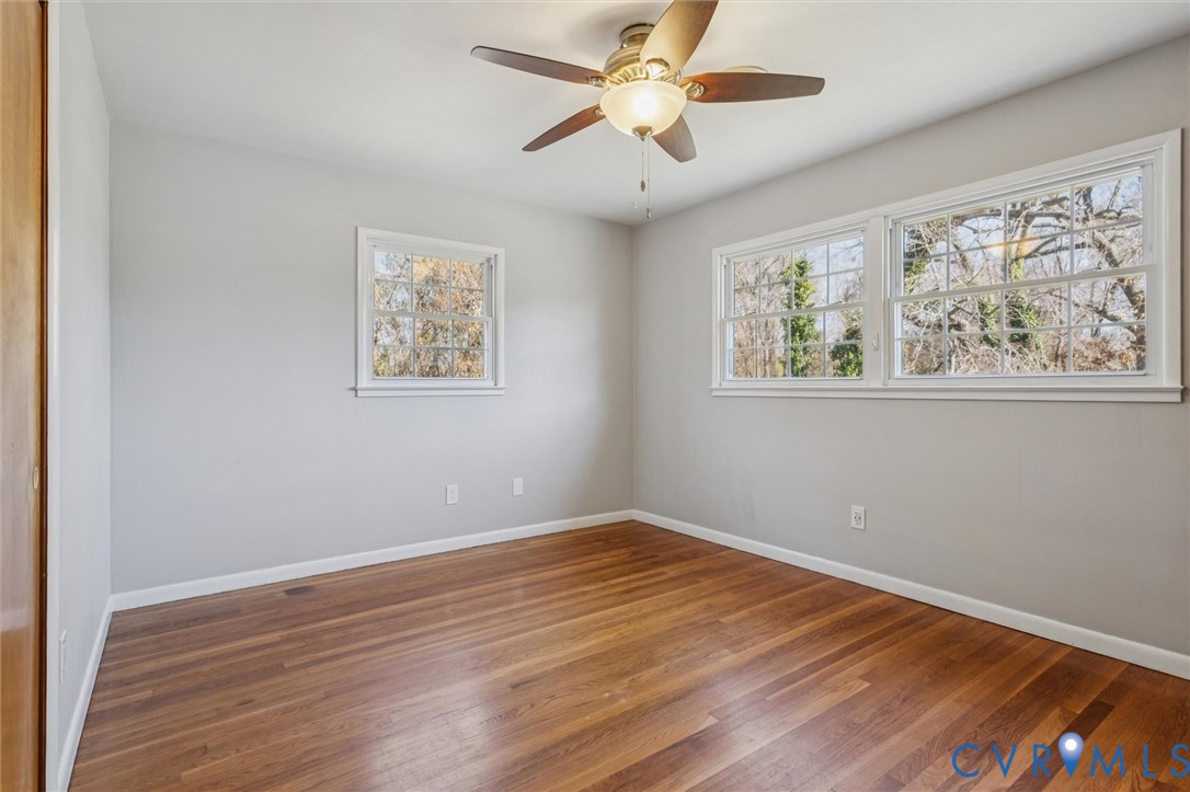 4 Michele Drive Hampton, VA 23669 - Photo 23 of 36 a view of an empty room with wooden floor and a window