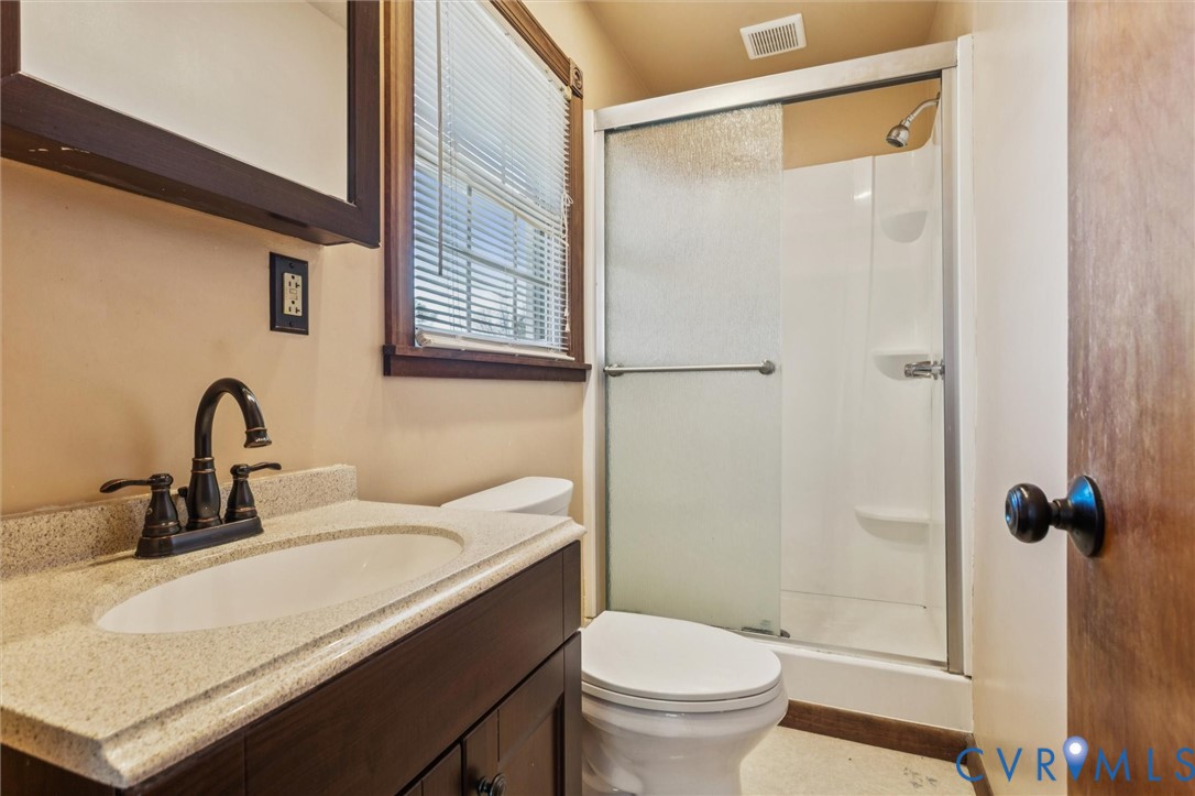4 Michele Drive Hampton, VA 23669 - Photo 26 of 36 a bathroom with a sink a toilet and shower