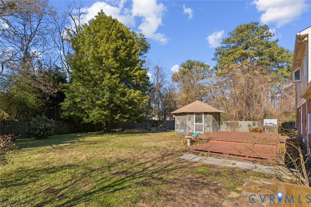 4 Michele Drive Hampton, VA 23669 - Photo 32 of 36 a backyard of a house with table and chairs