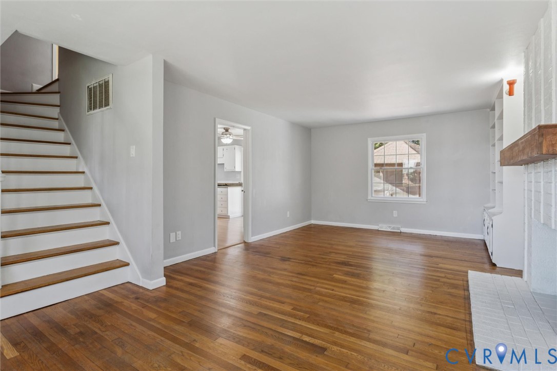 4 Michele Drive Hampton, VA 23669 - Photo 4 of 36 a view of an empty room with wooden floor and a window
