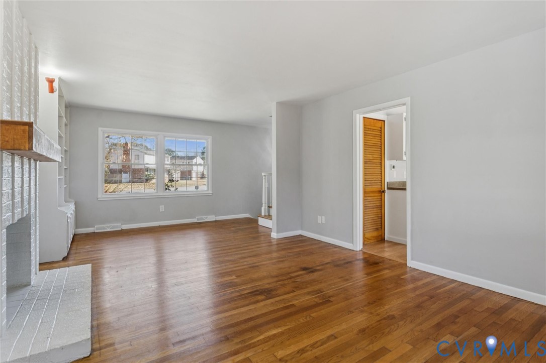 4 Michele Drive Hampton, VA 23669 - Photo 5 of 36 a view of an empty room with wooden floor and a window