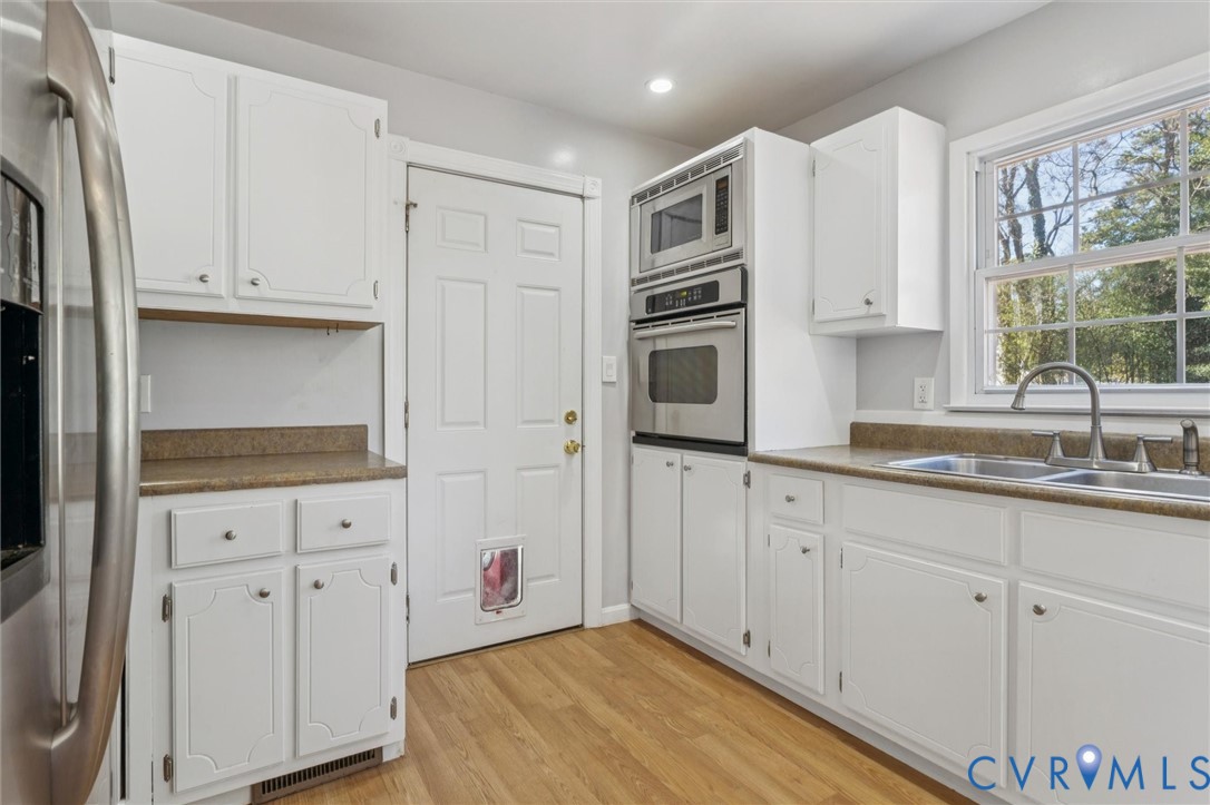 4 Michele Drive Hampton, VA 23669 - Photo 9 of 36 a kitchen with granite countertop white cabinets and sink