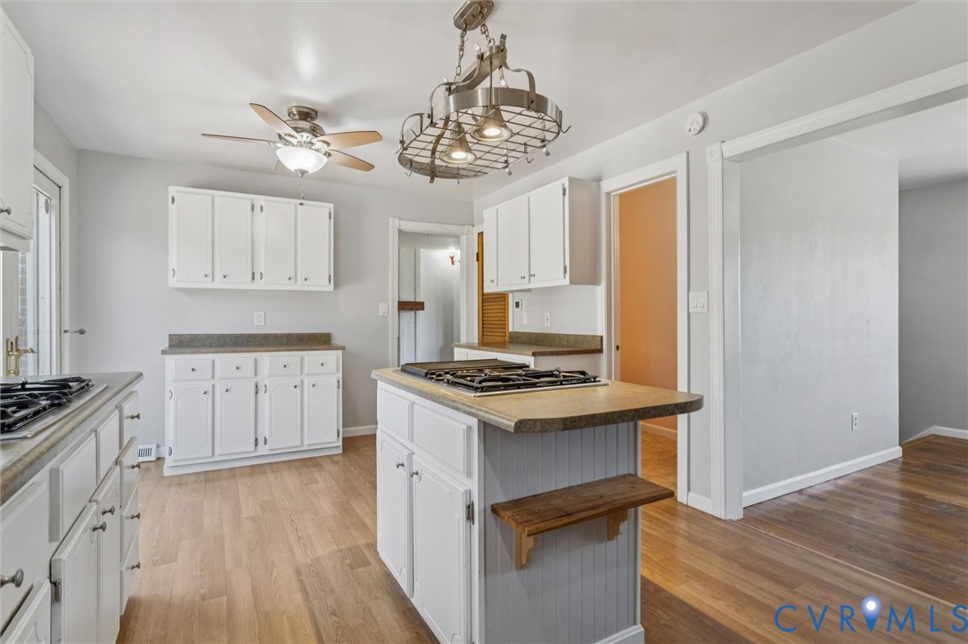 4 Michele Drive Hampton, VA 23669 - Photo 10 of 36 a kitchen with stainless steel appliances granite countertop a stove and a white cabinets