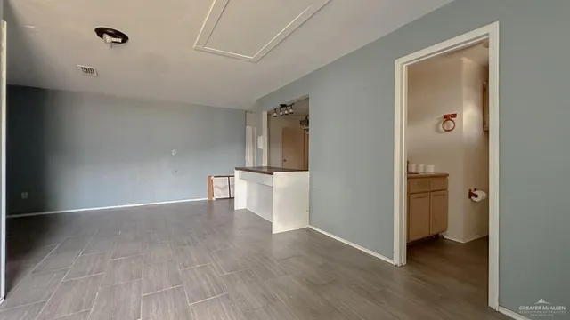 a view of a hallway with an entryway