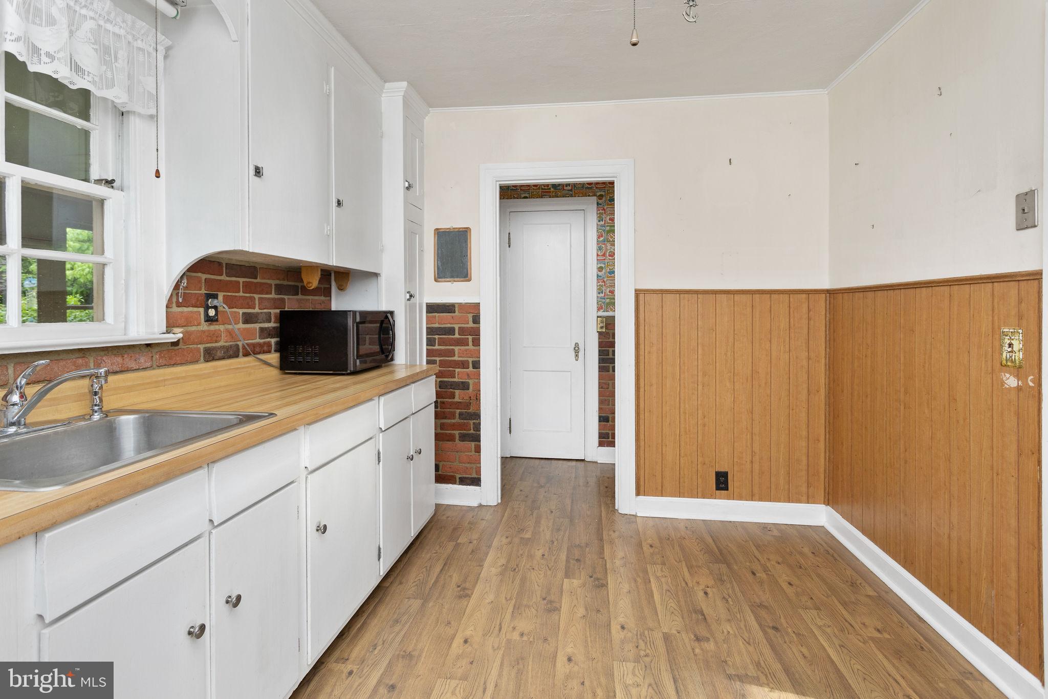 10 Pershing Avenue Ewing, NJ 08618 - Photo 12 of 24 a view of a kitchen with wooden floor and a sink