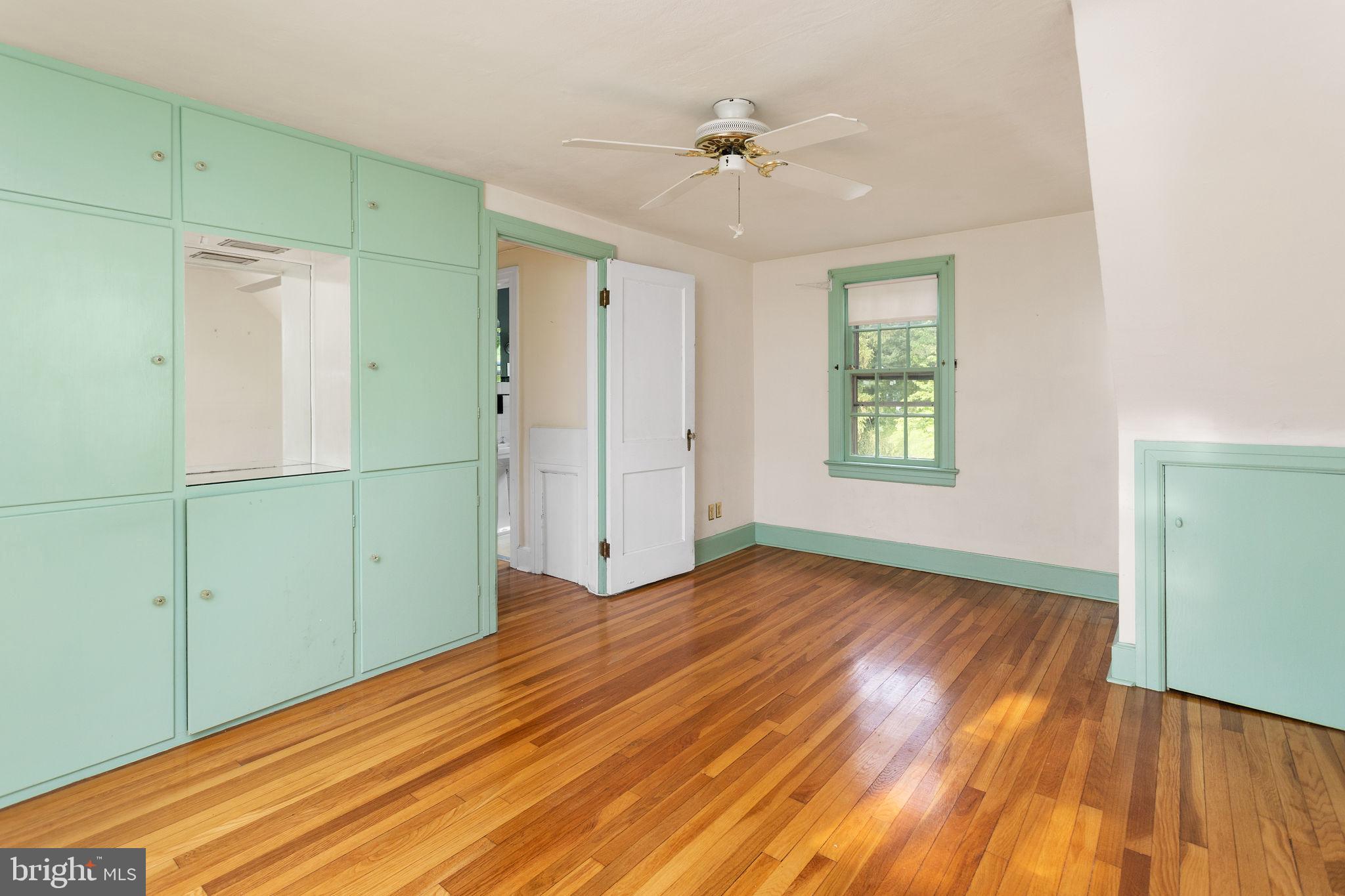 10 Pershing Avenue Ewing, NJ 08618 - Photo 16 of 24 a view of empty room with wooden floor and fan