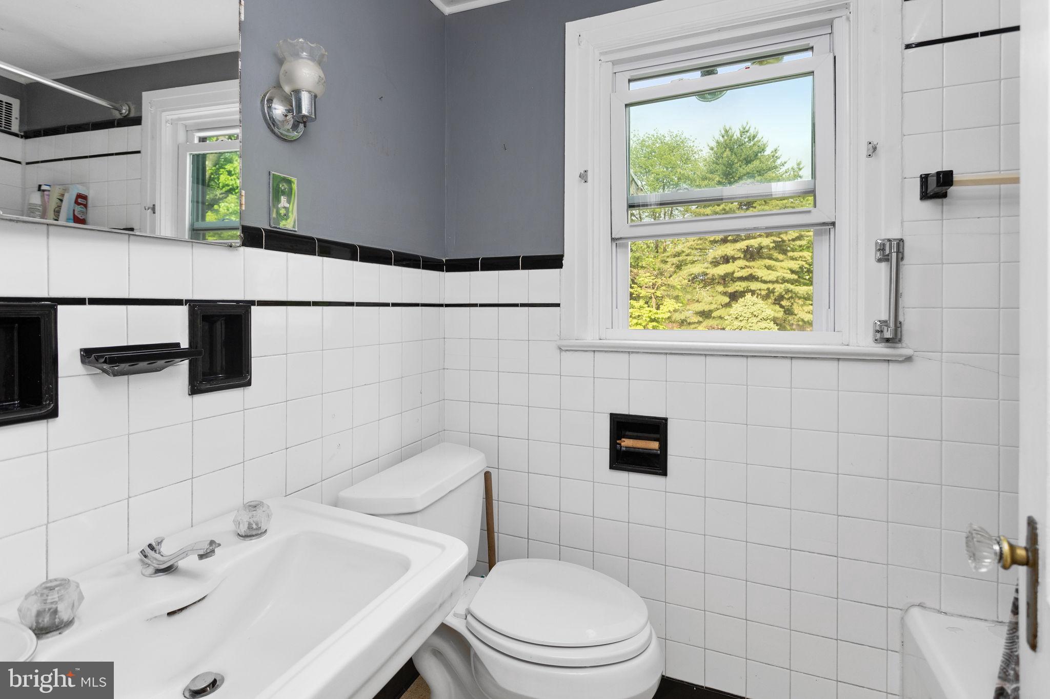 10 Pershing Avenue Ewing, NJ 08618 - Photo 18 of 24 a bathroom with a sink mirror and toilet