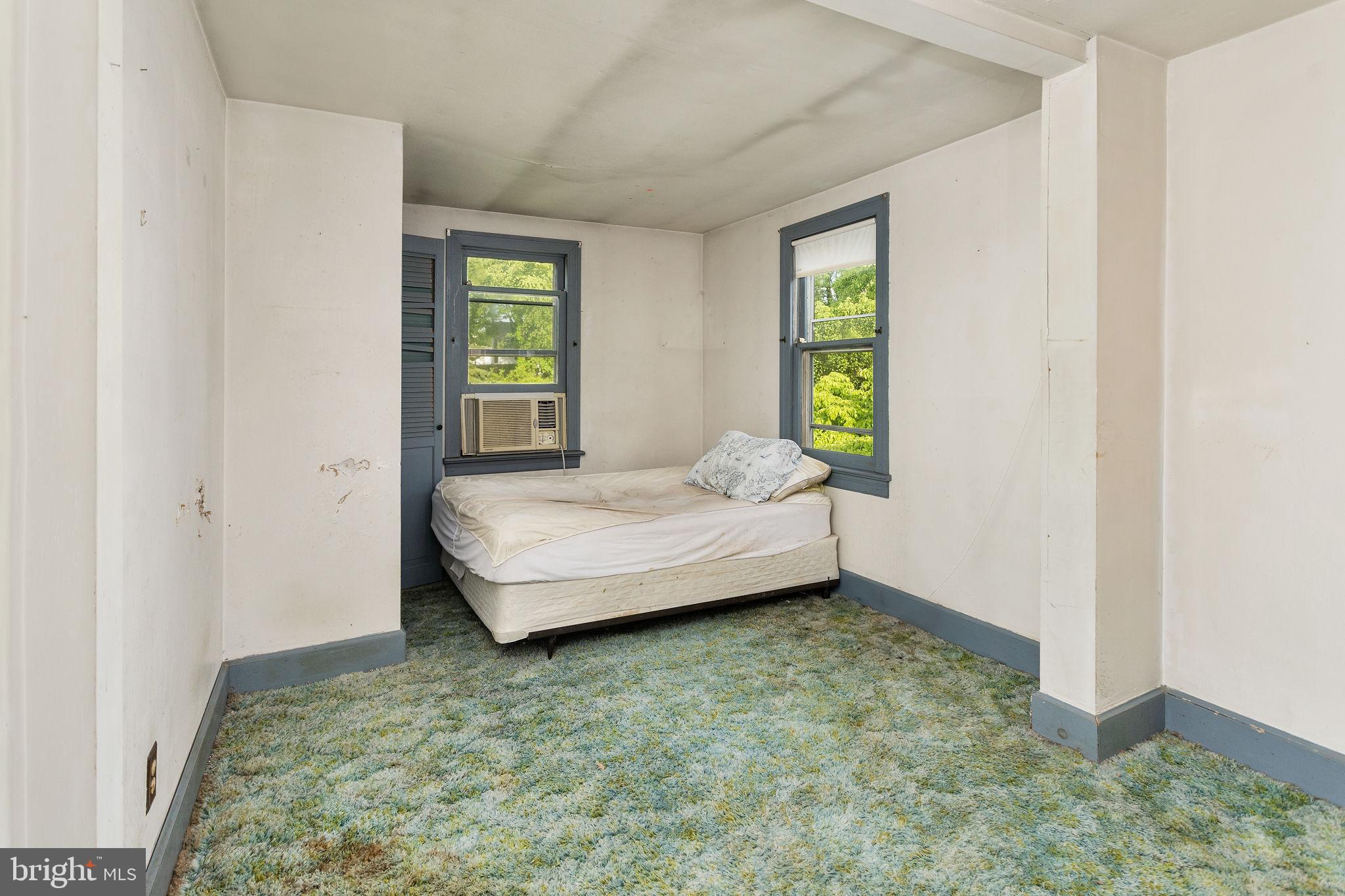 10 Pershing Avenue Ewing, NJ 08618 - Photo 19 of 24 a bedroom with a bed and a window