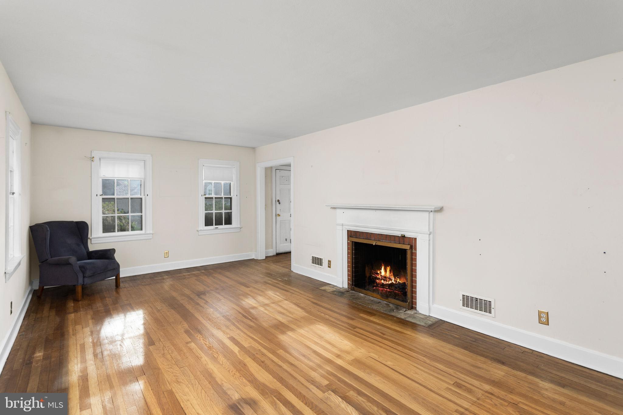 10 Pershing Avenue Ewing, NJ 08618 - Photo 6 of 24 a living room with furniture and a fireplace
