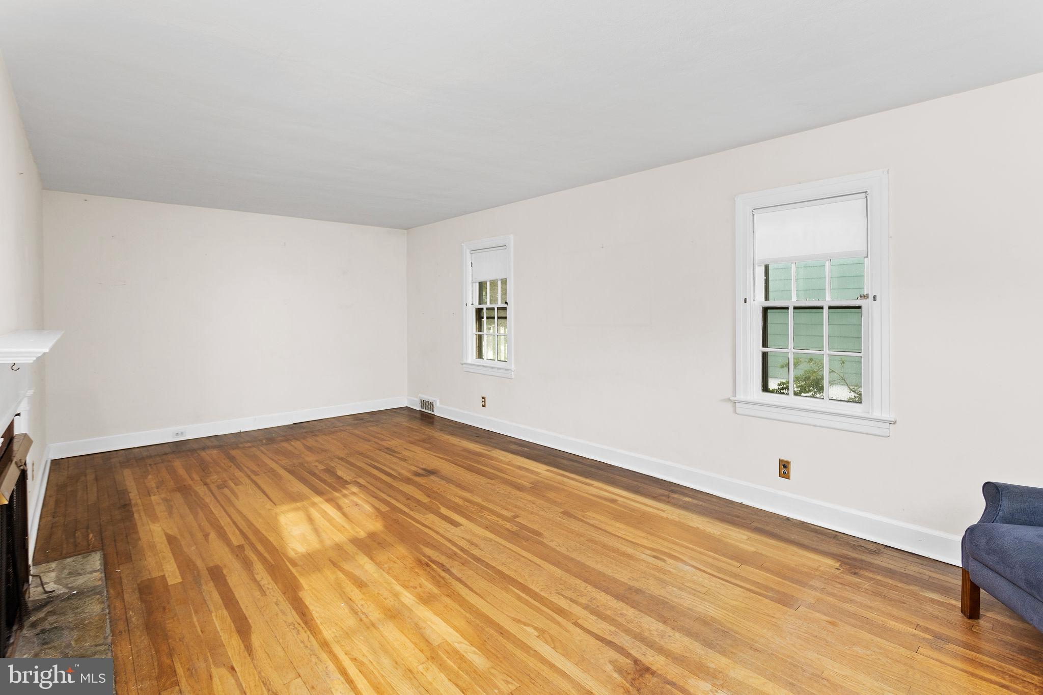 10 Pershing Avenue Ewing, NJ 08618 - Photo 7 of 24 a view of empty room with wooden floor and fan
