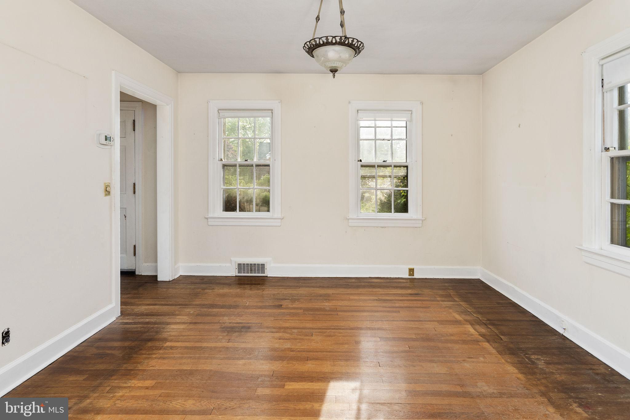 10 Pershing Avenue Ewing, NJ 08618 - Photo 8 of 24 a view of an empty room with wooden floor and a window