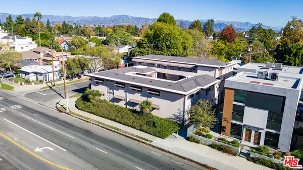 an aerial view of a house with a garden