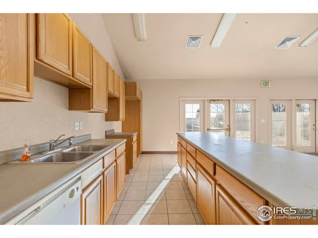 a kitchen that has a sink and a stove