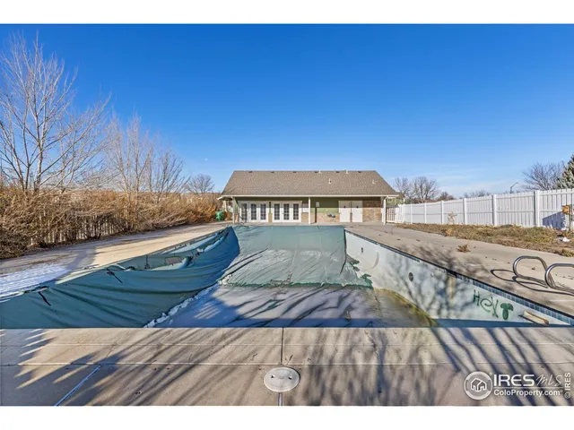 a view of a house with a wooden deck