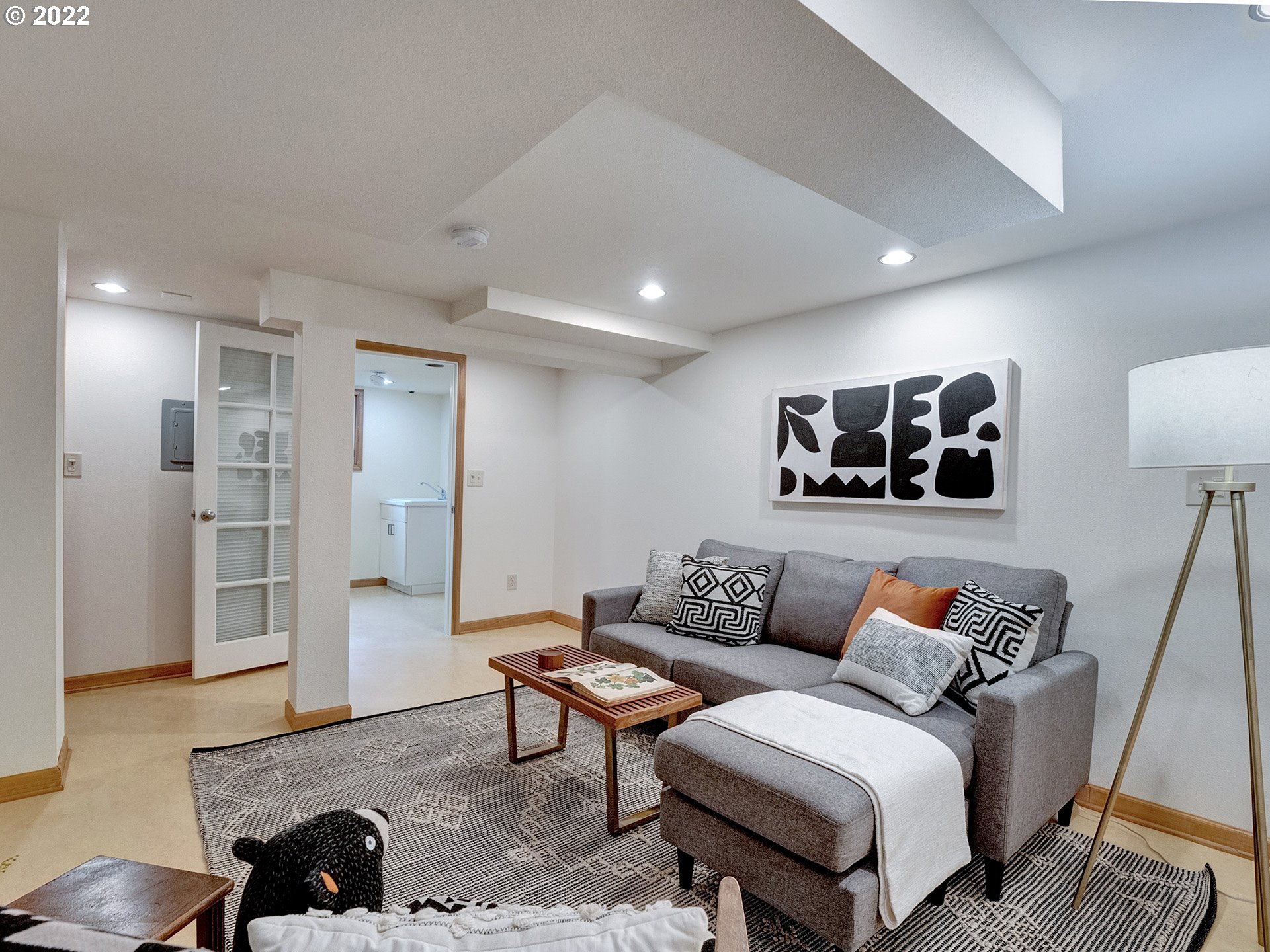 2307 Northeast Couch Street Portland, OR 97232 - Photo 23 of 32 a living room with furniture and kitchen view