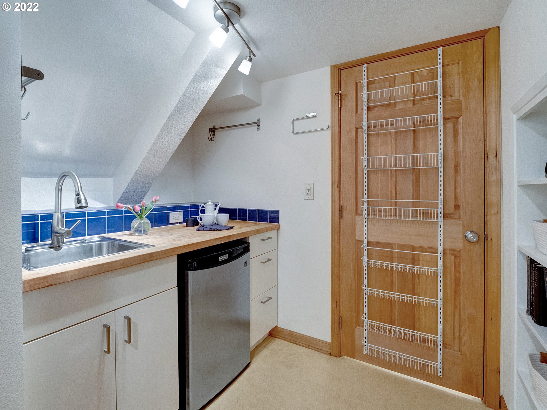 2307 Northeast Couch Street Portland, OR 97232 - Photo 24 of 32 a kitchen with a sink and cabinets