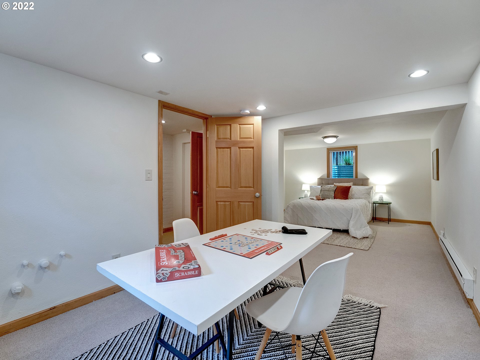 2307 Northeast Couch Street Portland, OR 97232 - Photo 27 of 32 a bed room with a bed and a table