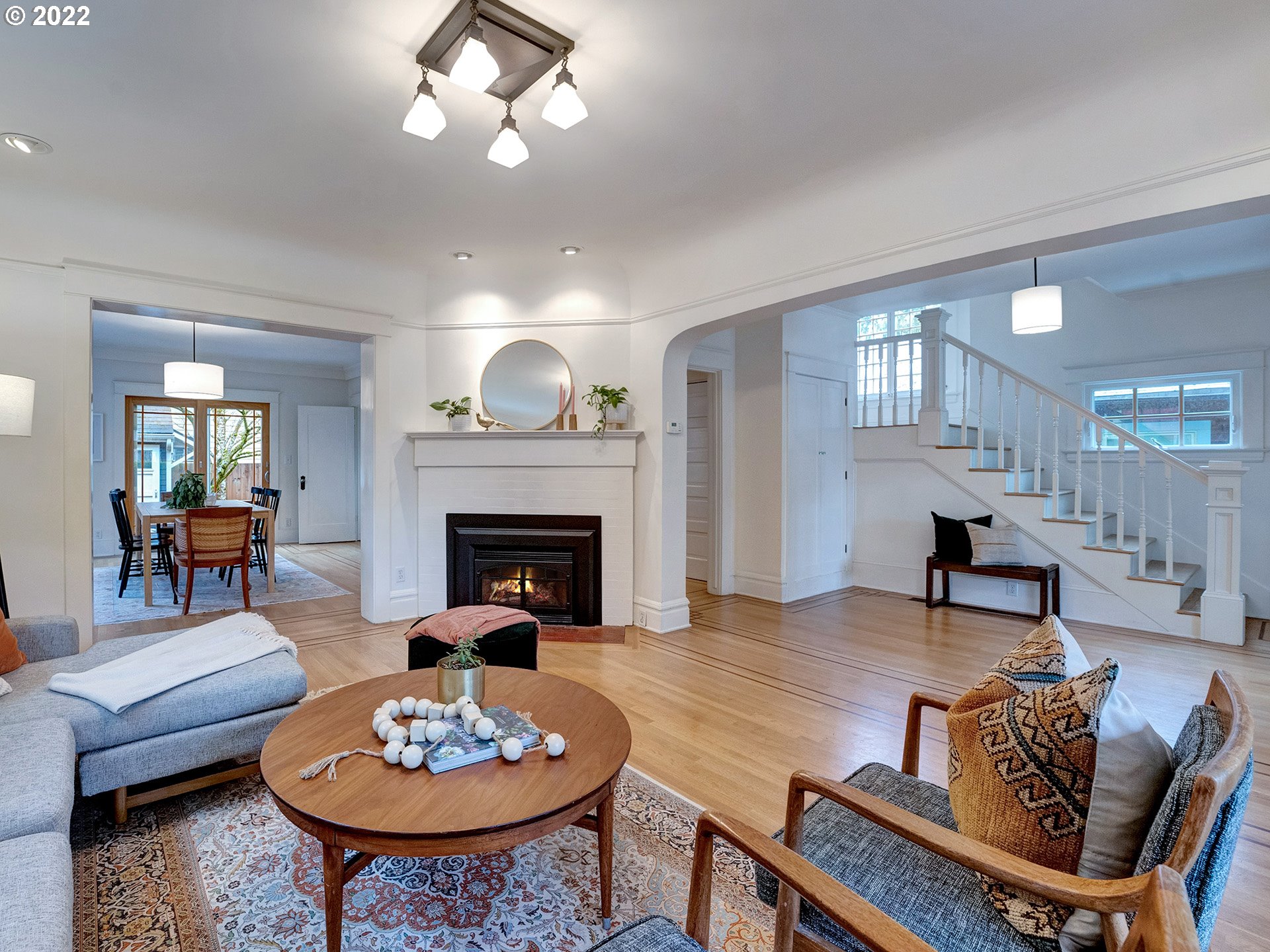 2307 Northeast Couch Street Portland, OR 97232 - Photo 4 of 32 a living room with furniture and a fireplace