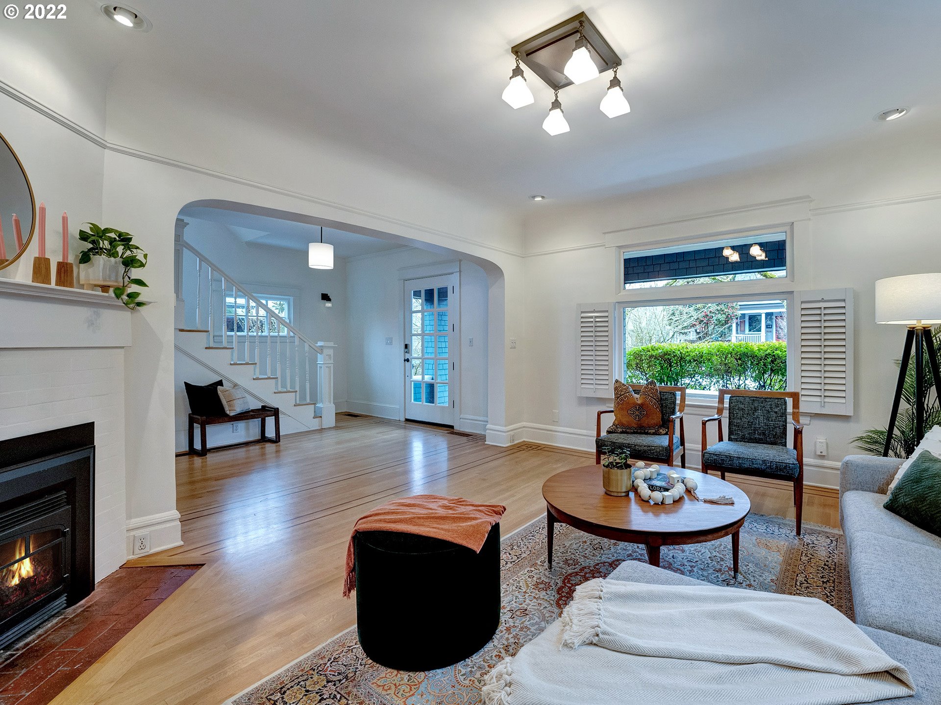 2307 Northeast Couch Street Portland, OR 97232 - Photo 5 of 32 a living room with fireplace furniture and a wooden floor