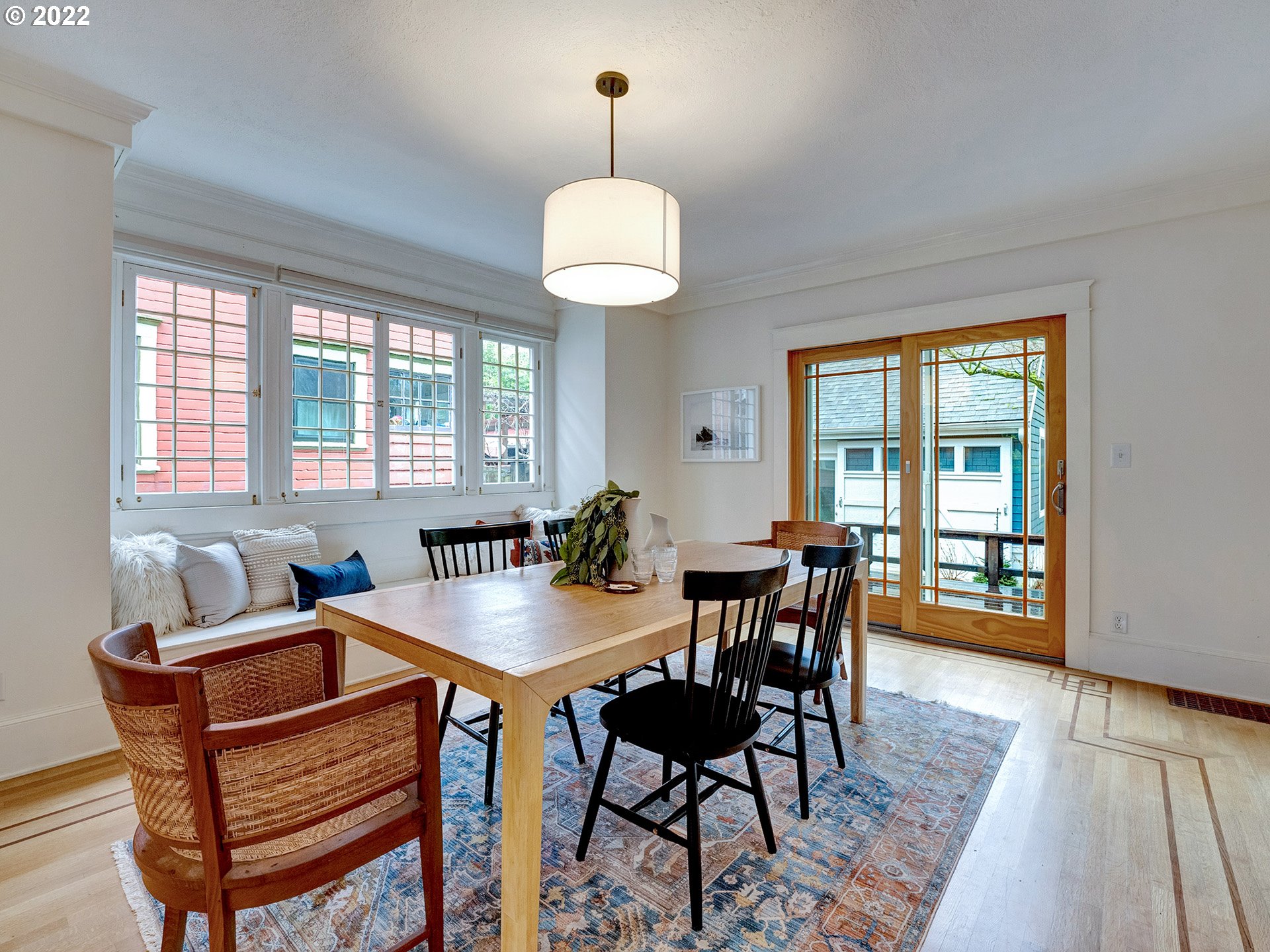 2307 Northeast Couch Street Portland, OR 97232 - Photo 6 of 32 a view of a dining room with furniture window and wooden floor