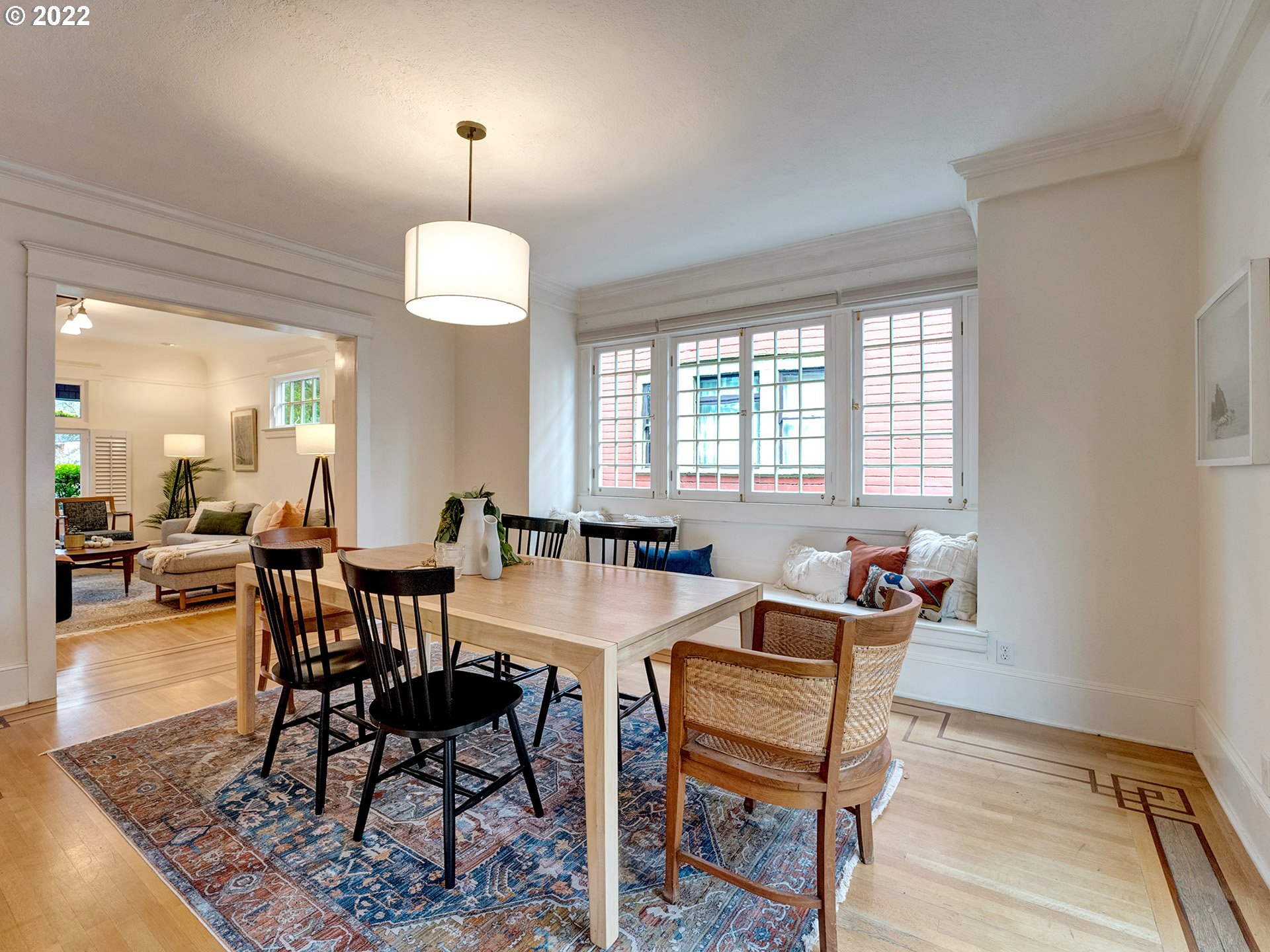 2307 Northeast Couch Street Portland, OR 97232 - Photo 7 of 32 a view of a a dining room with furniture window and wooden floor