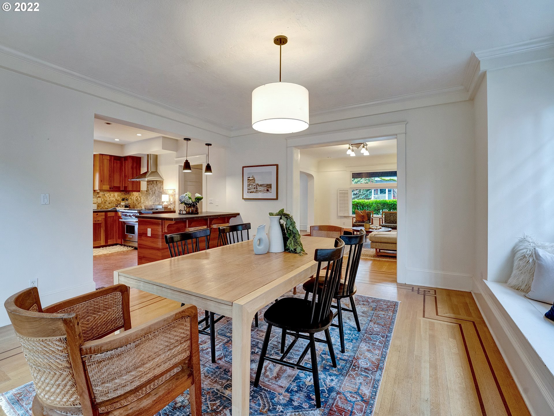 2307 Northeast Couch Street Portland, OR 97232 - Photo 8 of 32 a view of a dining room with furniture and wooden floor