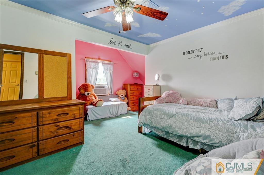 22 Cottrell Road Old Bridge, NJ 07747 - Photo 25 of 32 a spacious bedroom with two beds and a chandelier