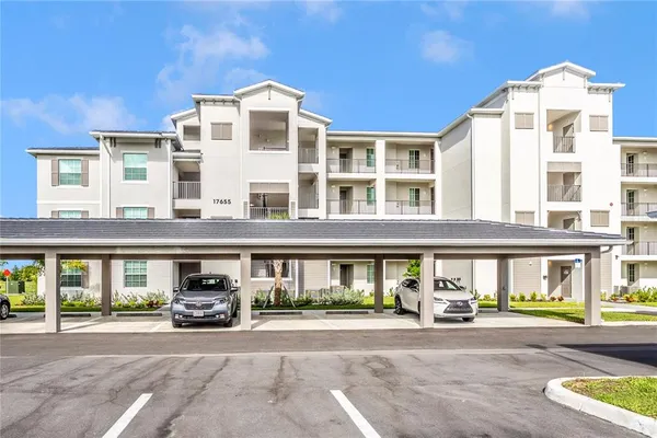 a view of a building with a lot of windows and a clock