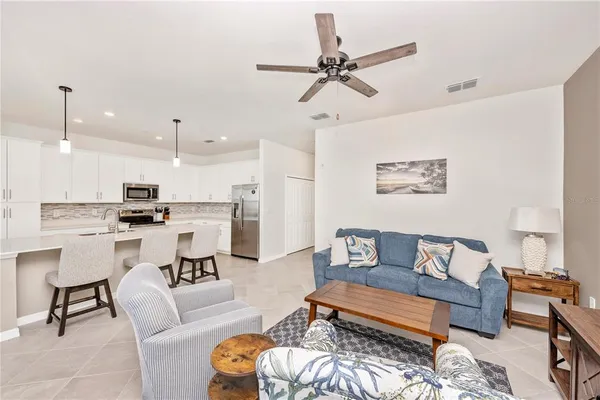 a bathroom with a granite countertop toilet sink and mirror