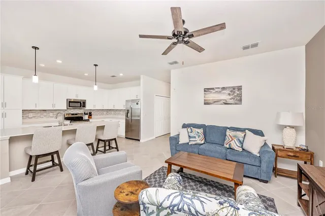 a bathroom with a granite countertop toilet sink and mirror