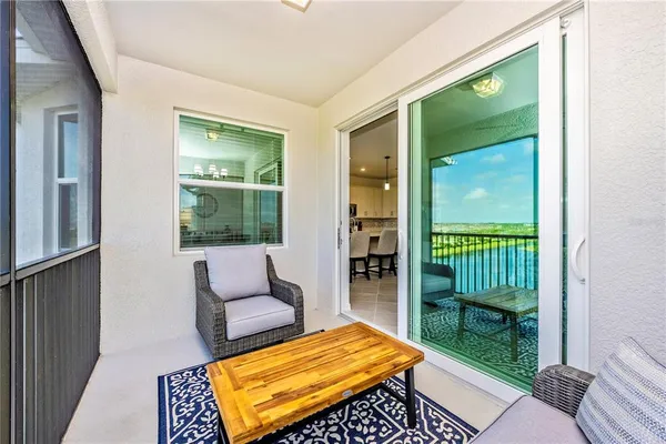 a view of a room with gym equipment and a large window