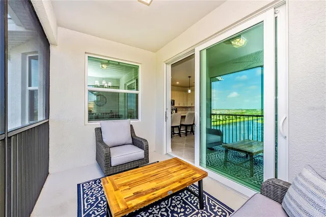 a view of a room with gym equipment and a large window