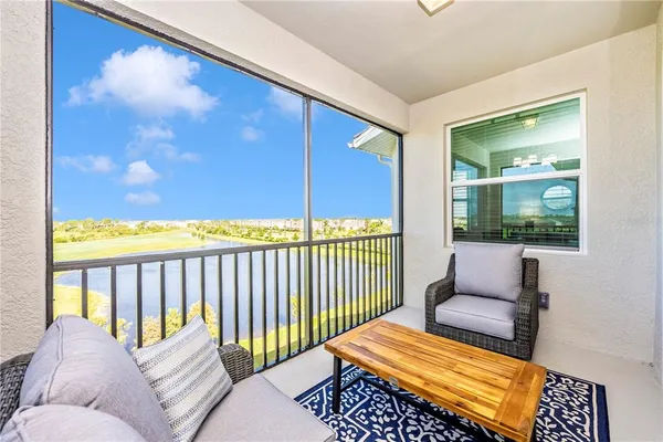 a living room with lots of furniture and a chandelier