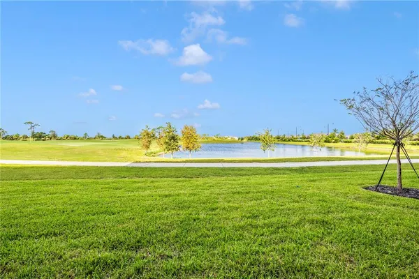 a view of a house with backyard porch and sitting area