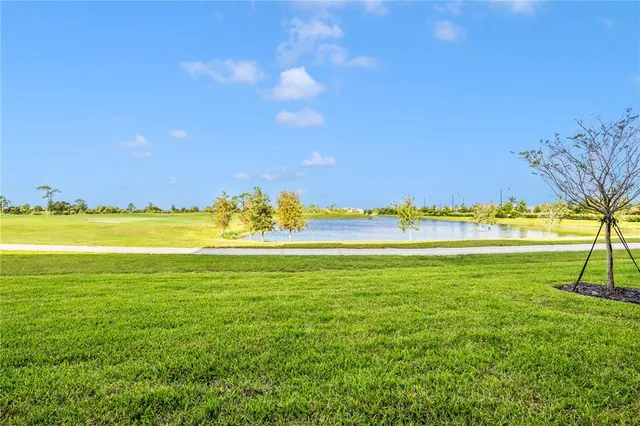 a view of a house with backyard porch and sitting area