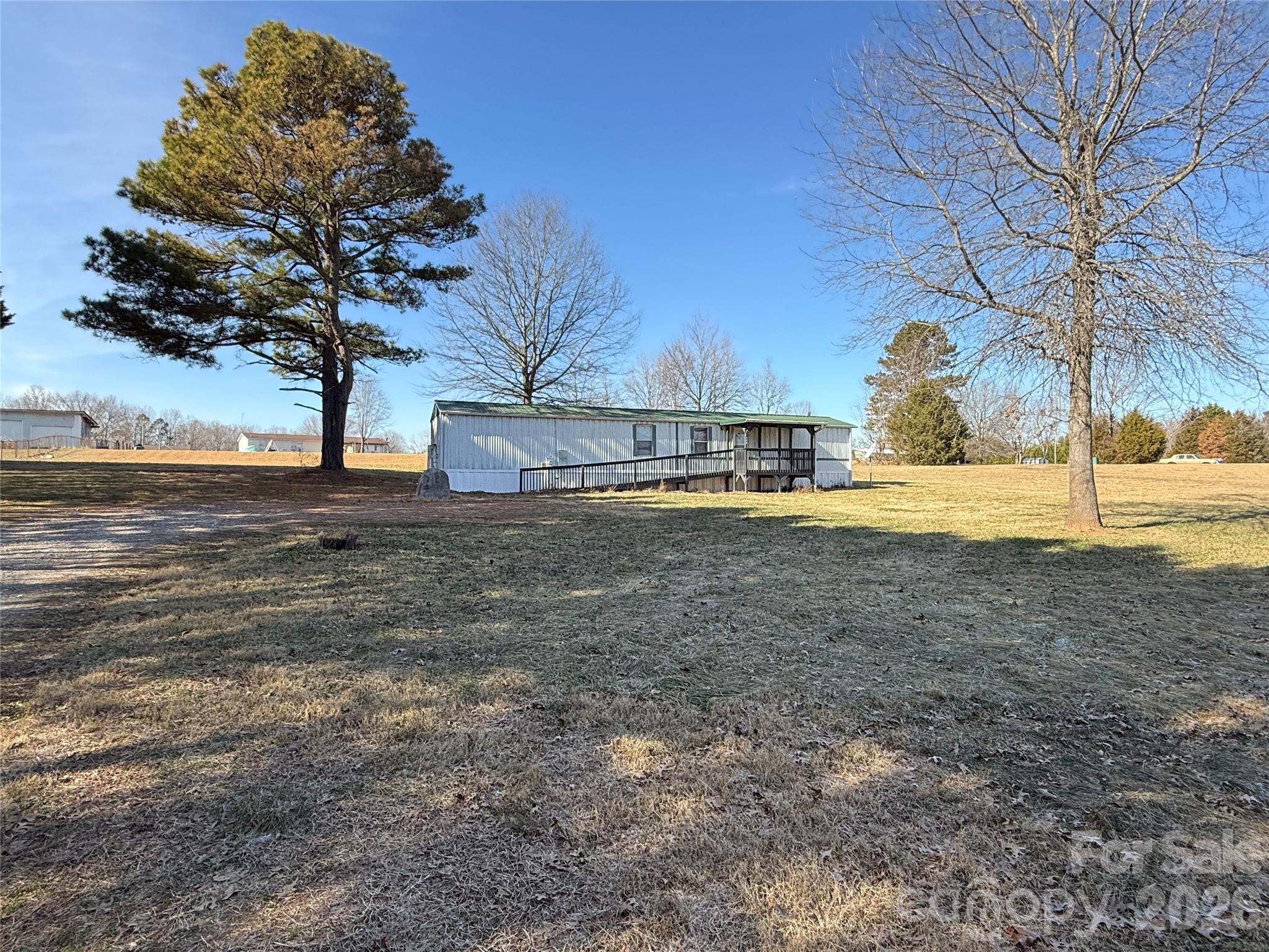 450 Ridgeland Drive Cleveland, NC 27013 - Photo 1 of 14 a view of a yard with an tree