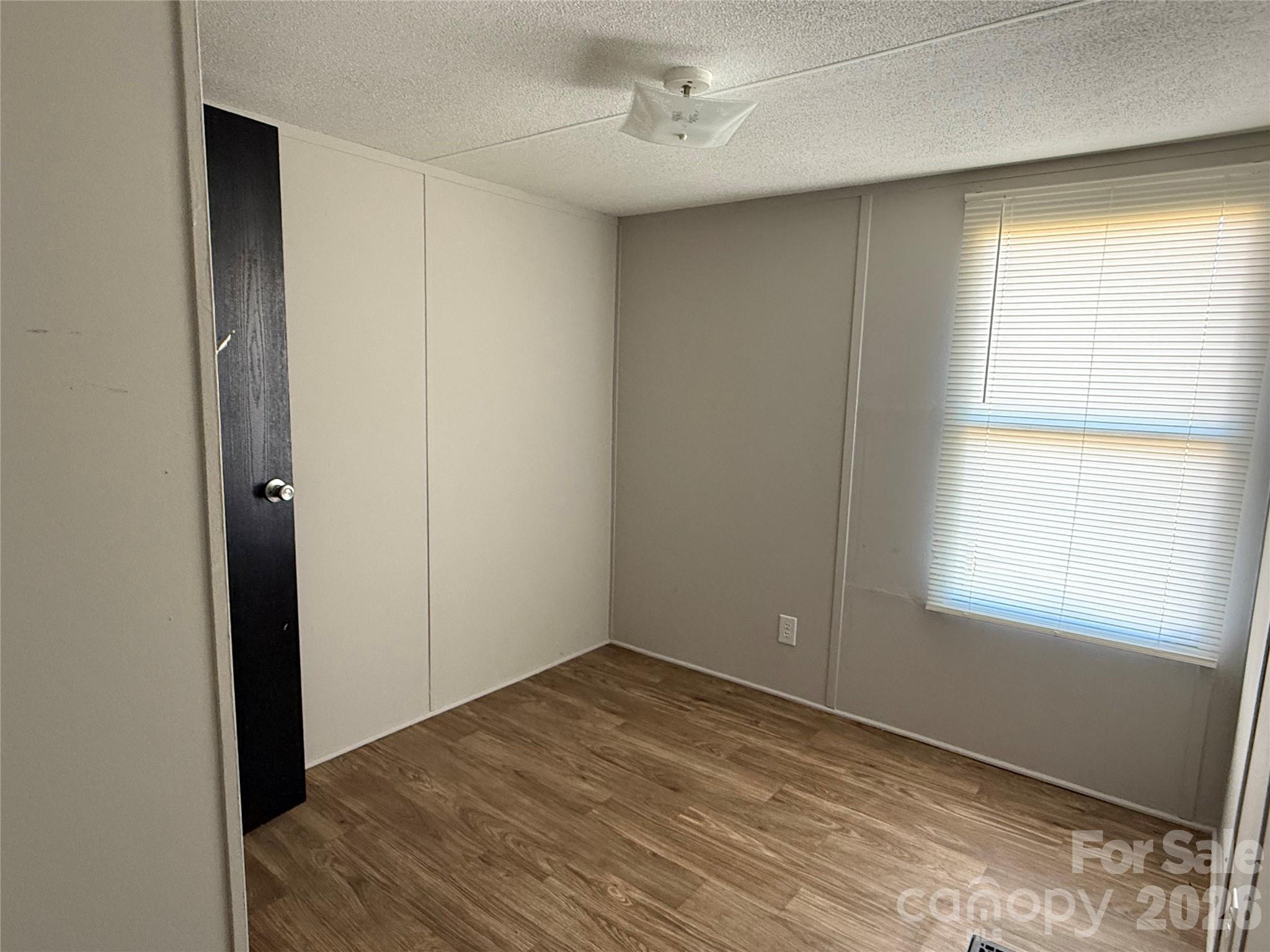 450 Ridgeland Drive Cleveland, NC 27013 - Photo 11 of 14 a view of an empty room with a window