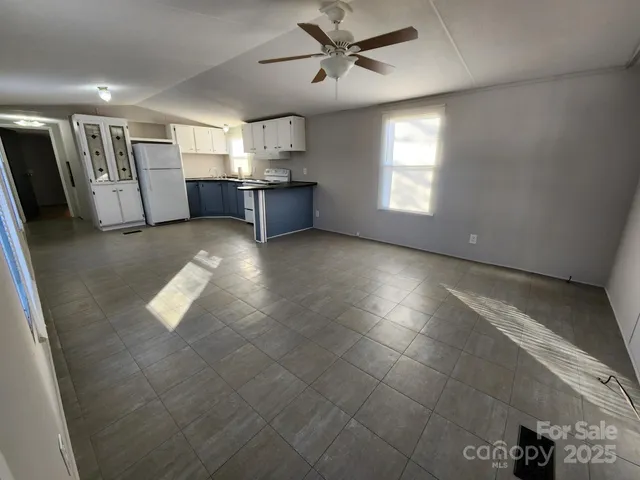 a view of a kitchen with a sink and a window