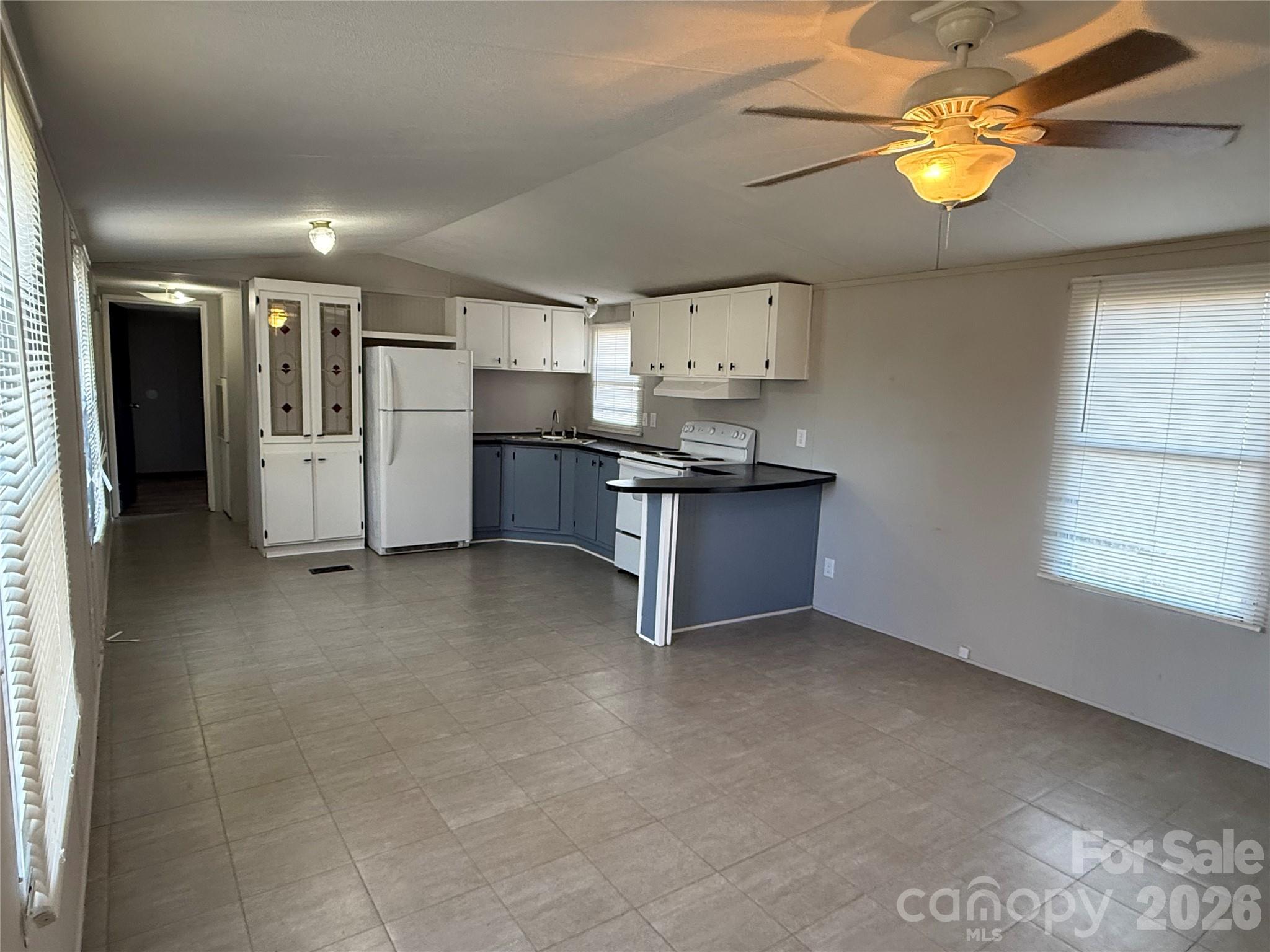 450 Ridgeland Drive Cleveland, NC 27013 - Photo 5 of 14 a view of kitchen with windows