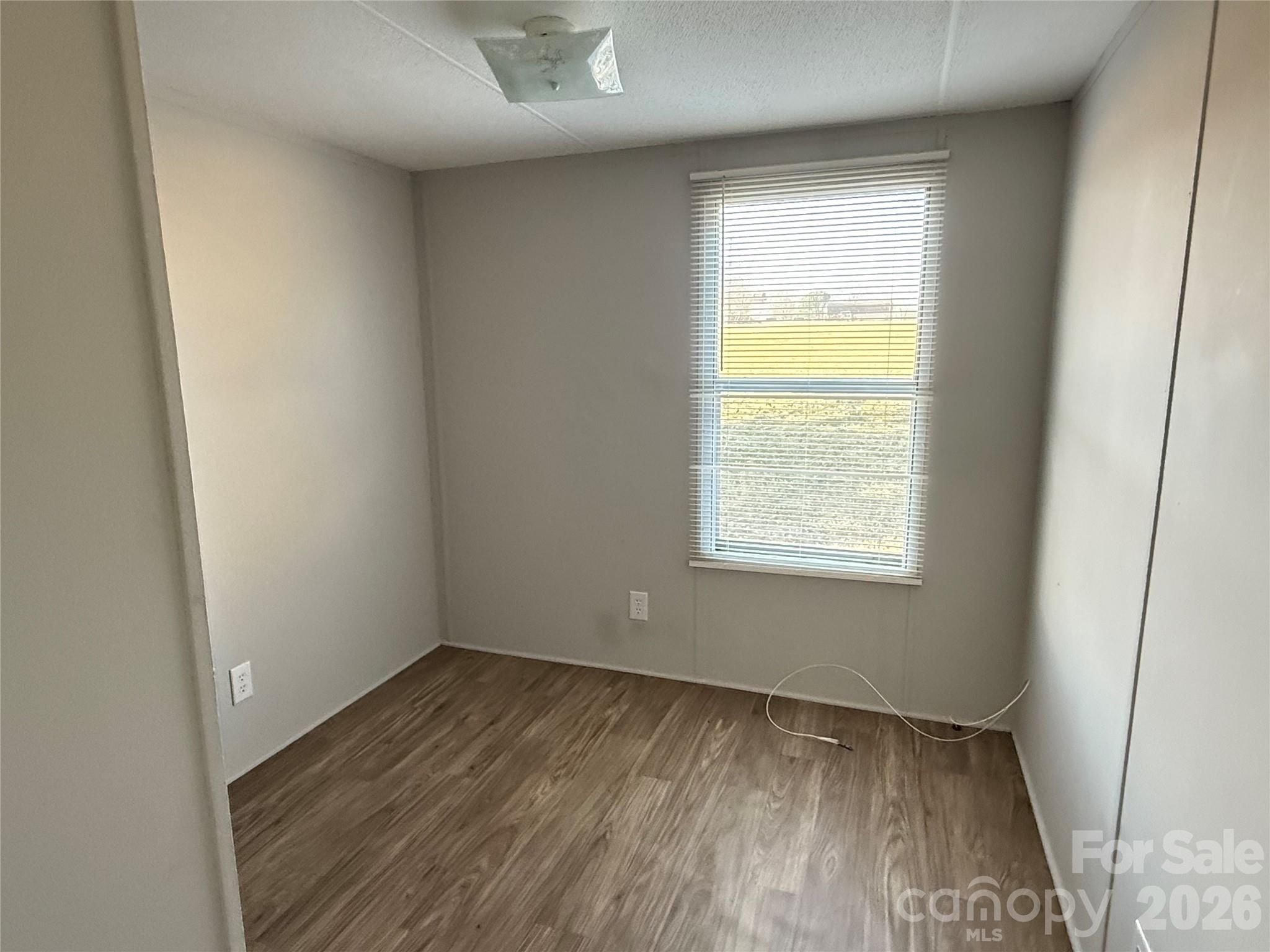 450 Ridgeland Drive Cleveland, NC 27013 - Photo 10 of 14 an empty room with a window