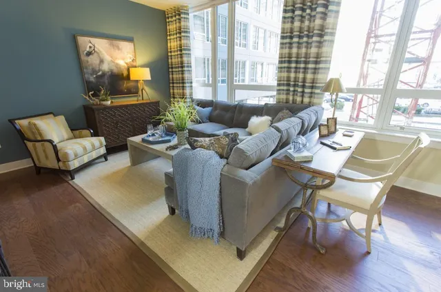a living room with furniture and a large window