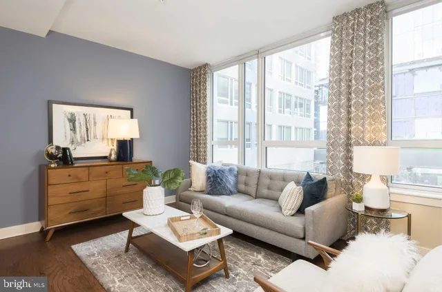 a living room with furniture and a window
