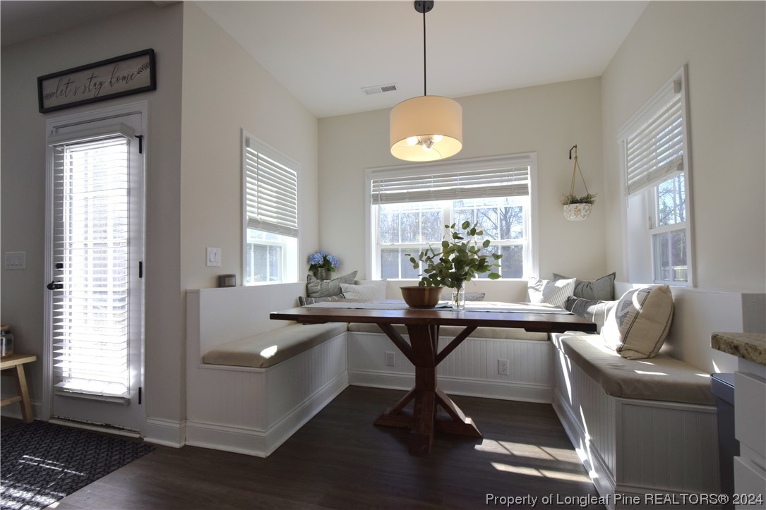 2015 Hayfield Road Wade, NC 28395 - Photo 21 of 50 a view of a dining room and livingroom with furniture window and wooden floor