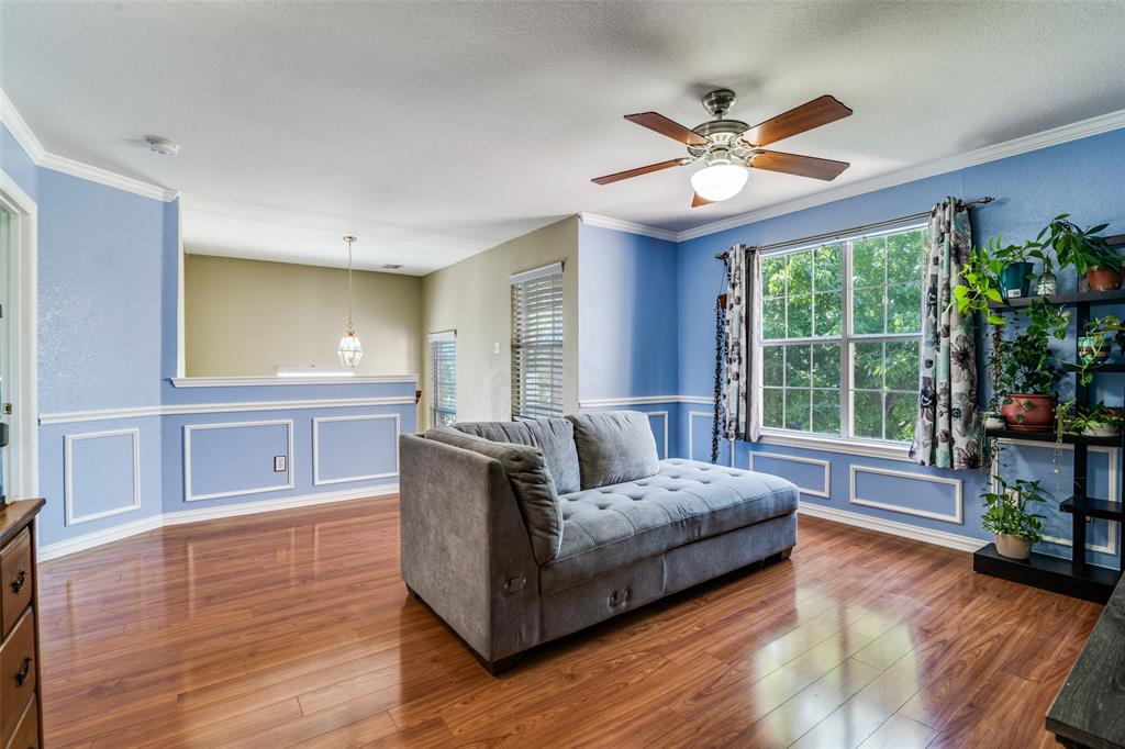 10702 Augusta Lane Rowlett, TX 75089 - Photo 13 of 25 a living room with furniture and a large window