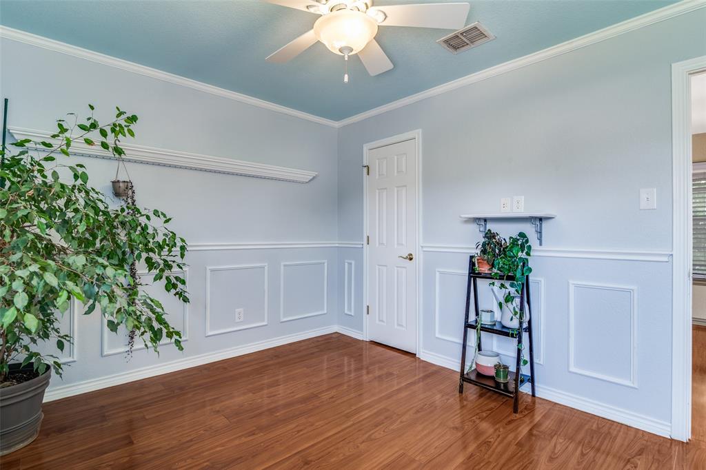 10702 Augusta Lane Rowlett, TX 75089 - Photo 22 of 25 a workspace with furniture and a potted plant