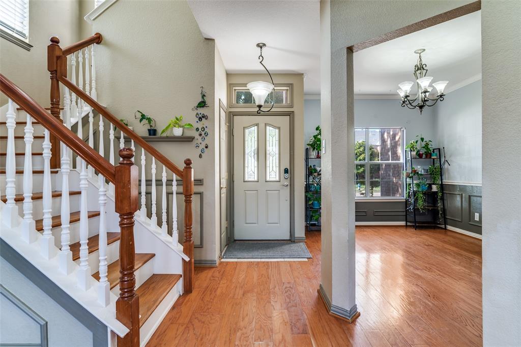 10702 Augusta Lane Rowlett, TX 75089 - Photo 3 of 25 a view of a livingroom with wooden floor and staircase