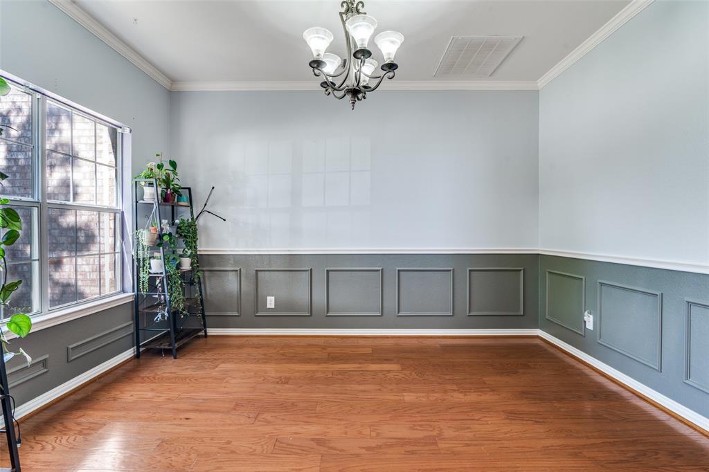 10702 Augusta Lane Rowlett, TX 75089 - Photo 4 of 25 a view of an empty room with a window