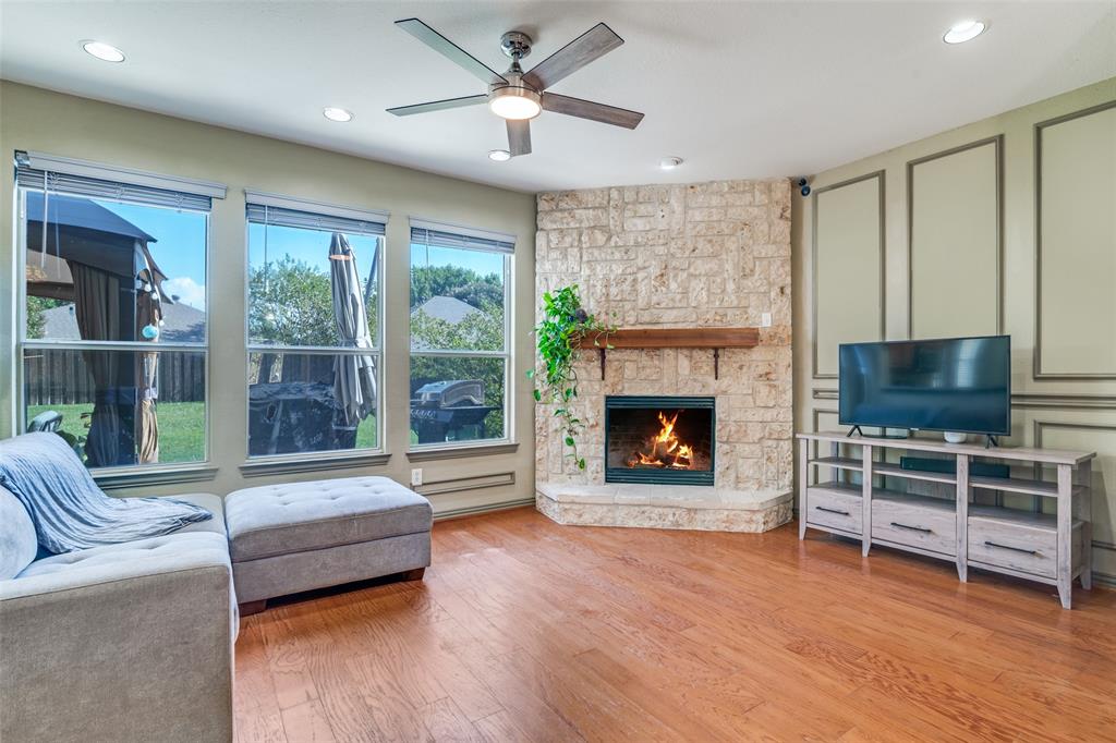 10702 Augusta Lane Rowlett, TX 75089 - Photo 5 of 25 a living room with furniture and a fireplace