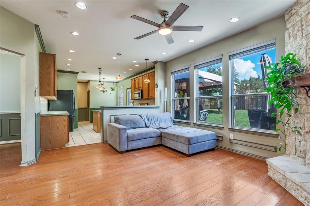 10702 Augusta Lane Rowlett, TX 75089 - Photo 6 of 25 a living room with furniture and a potted plant